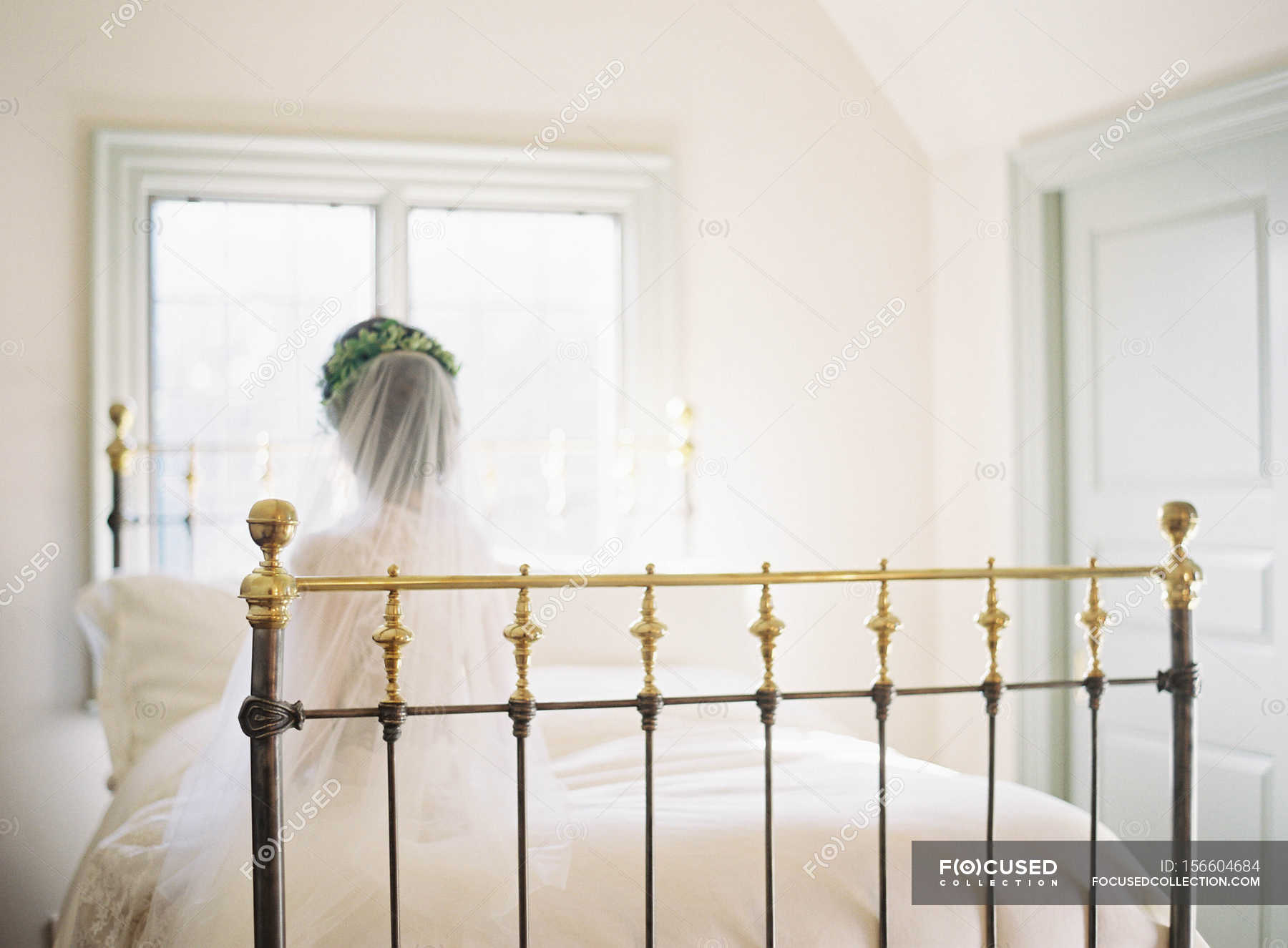 Women In Wedding Dress Sitting On Bed Individuality Brunette Stock