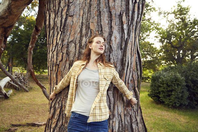 Woman Leaning Against Tree Trunk Sensuality Spirituality Stock Photo