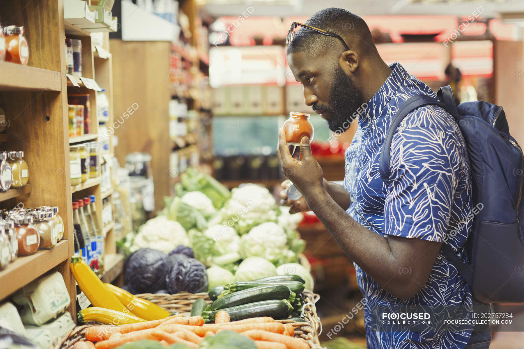 Man Shopping Smelling Spices In Grocery Store Beard Jar Stock