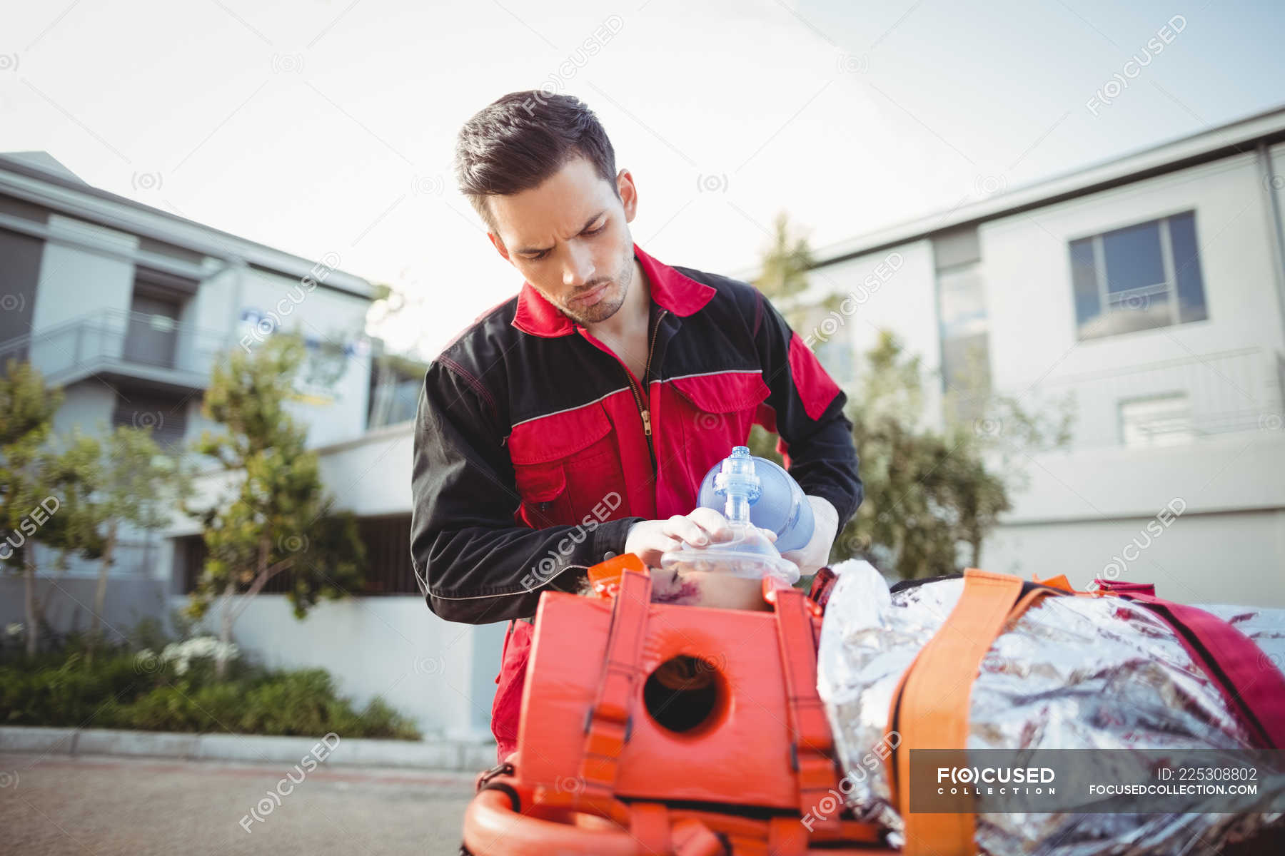 Paramedic Giving Oxygen To Injured Woman At Accident Spot Healthcare