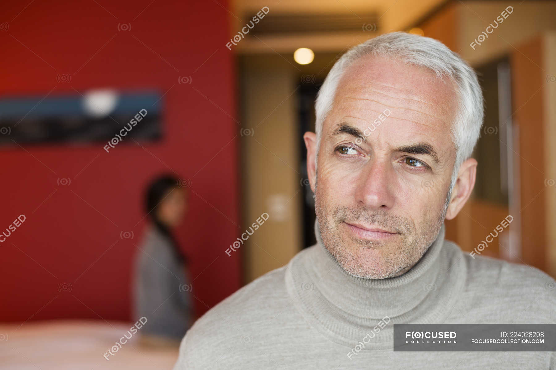 Portrait Of Thoughtful Mature Man Sitting In A Hotel Room Male Front