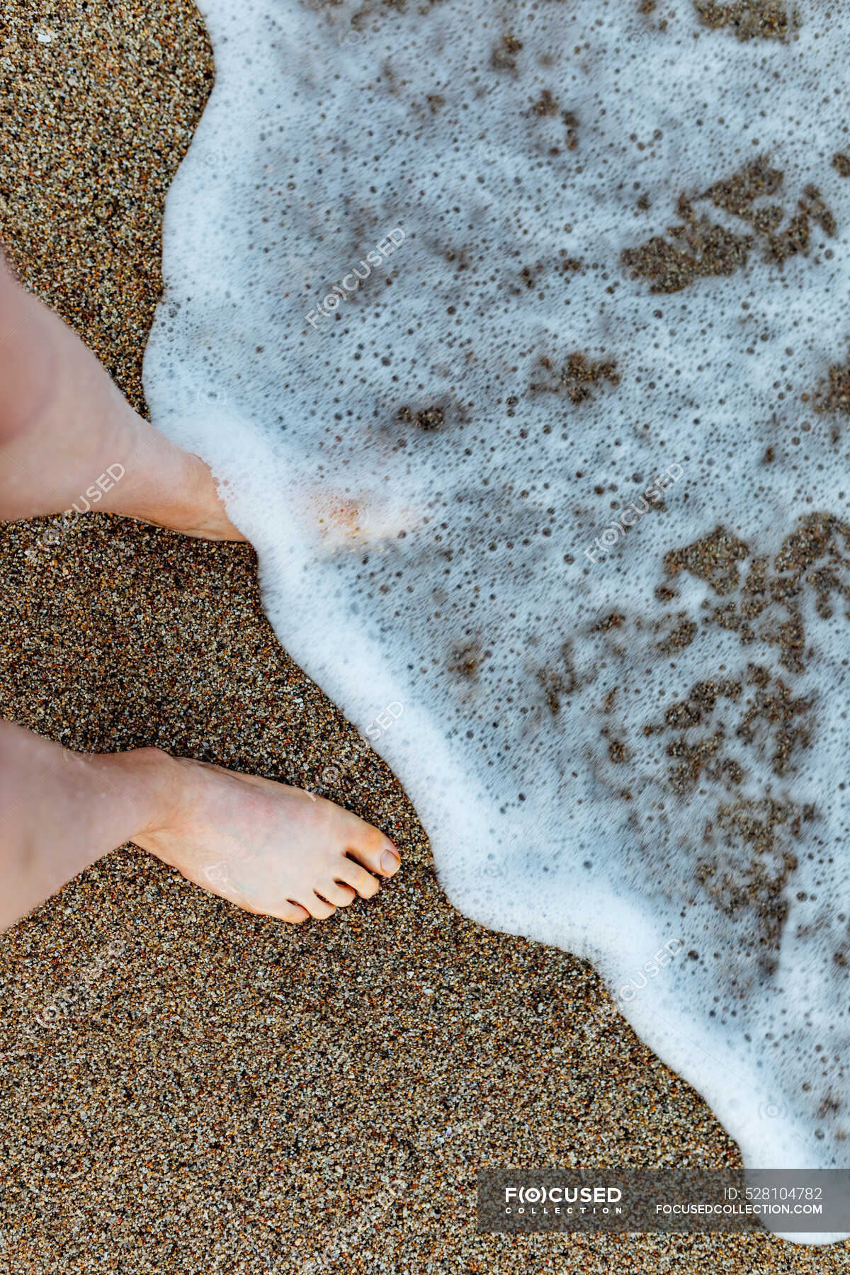 From Above Of Crop Unrecognizable Barefoot Female Traveler Standing On