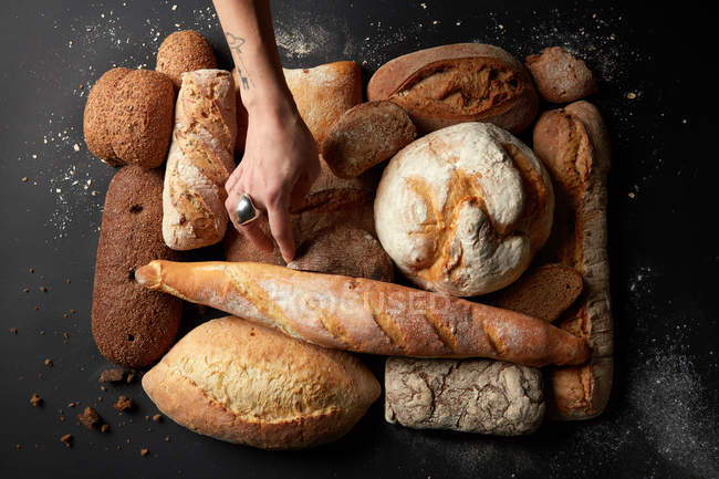 Different kinds of bread on background — Stock Photo