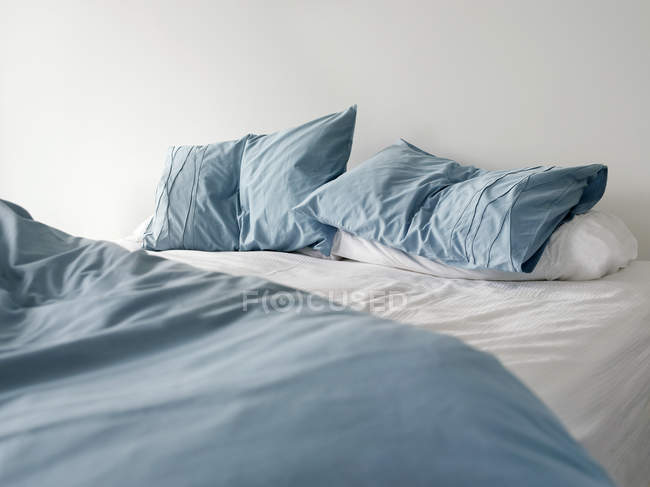 Unmade empty bed — Stock Photo
