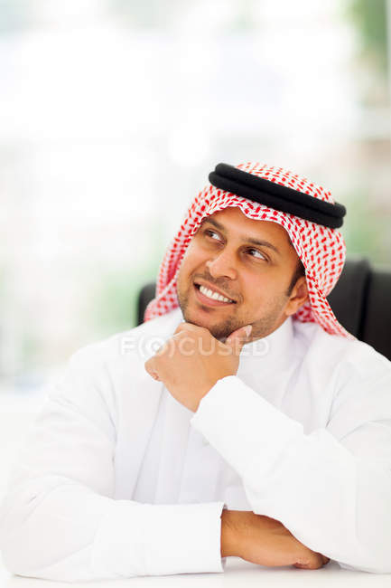 Arabian businessman daydreaming — Stock Photo