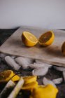 Sliced fresh lemons and ice on table — Stock Photo