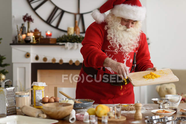 Santa Claus Cooking Christmas Cookies — Stock Photo