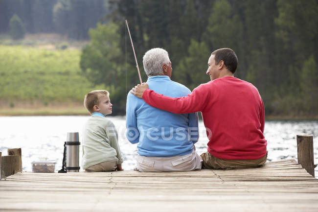 Father, son, grandfather fishing — Stock Photo
