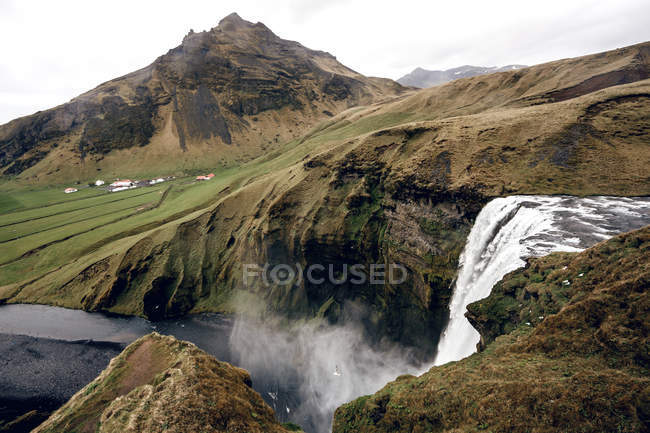 Famous Skogafoss waterfall in Iceland at dusk — Stock Photo