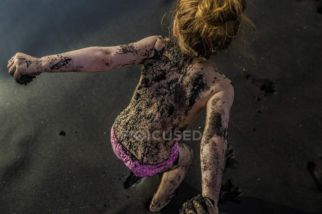 Girl soiled with sand — Stock Photo