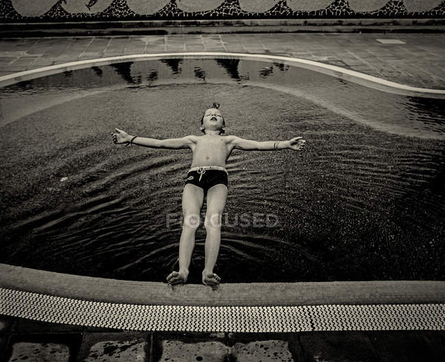 Boy falling on water — Stock Photo