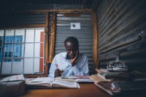 African young adult man studying — Stock Photo