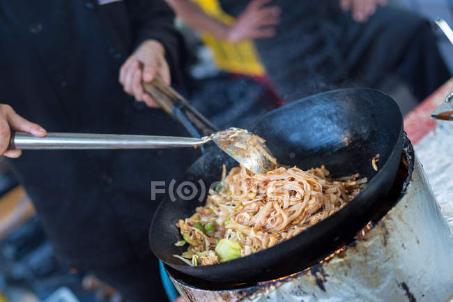 Cheff cooking on outdoor street food festival. — Stock Photo