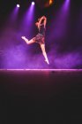 Young girl dancing on stage — Stock Photo