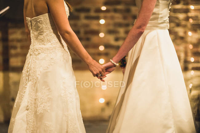 Loving couple holding hands — Stock Photo