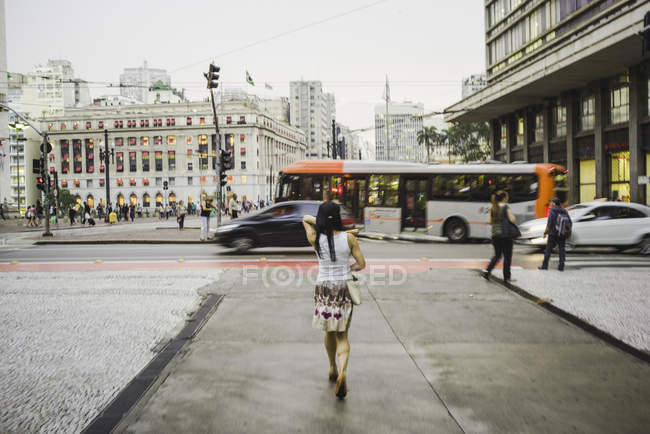 Woman walking on street — Stock Photo