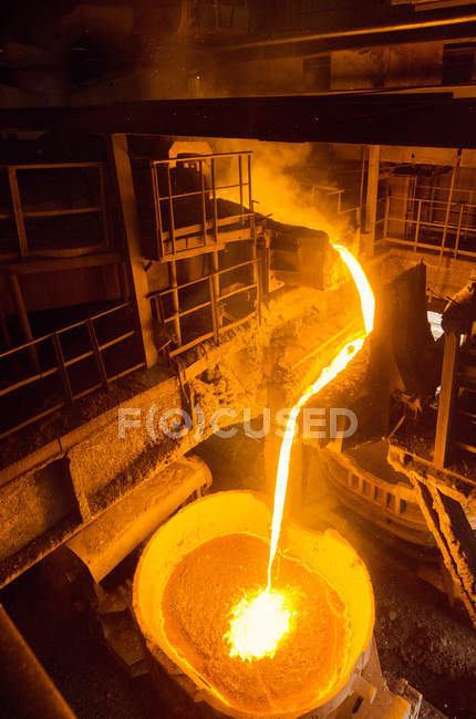 Liquid iron inside of plant and trains — Stock Photo