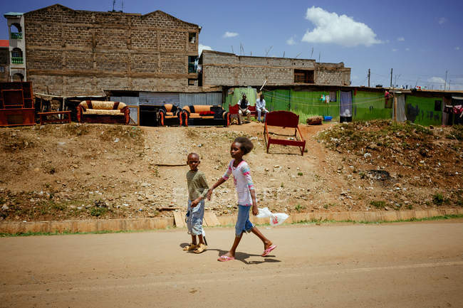 Children walking on street — Stock Photo