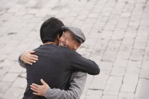 Grandfather and grandson hugging — Stock Photo