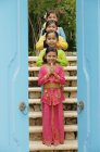 Balinese girls standing in row — Stock Photo