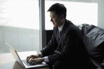 Businessman working on laptop — Stock Photo