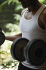 Man exercising with dumbbells — Stock Photo