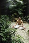Man doing yoga exercises — Stock Photo