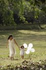 Mother and daughter in park — Stock Photo