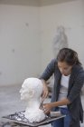 Woman working at sculpture — Stock Photo