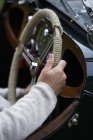 Senior man hands on steering wheel — Stock Photo