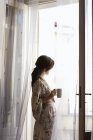 Woman having morning coffee — Stock Photo