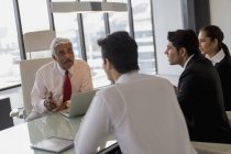Businessman leading discussion — Stock Photo