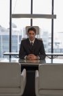 Businessman sitting at desk — Stock Photo