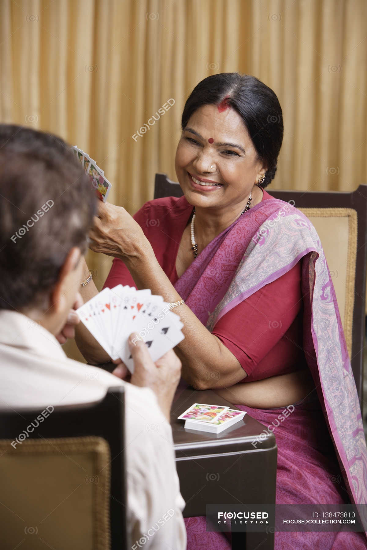 Couple Playing Cards Necklace Bindi Stock Photo 138473810   Focused 138473810 Stock Photo Couple Playing Cards 