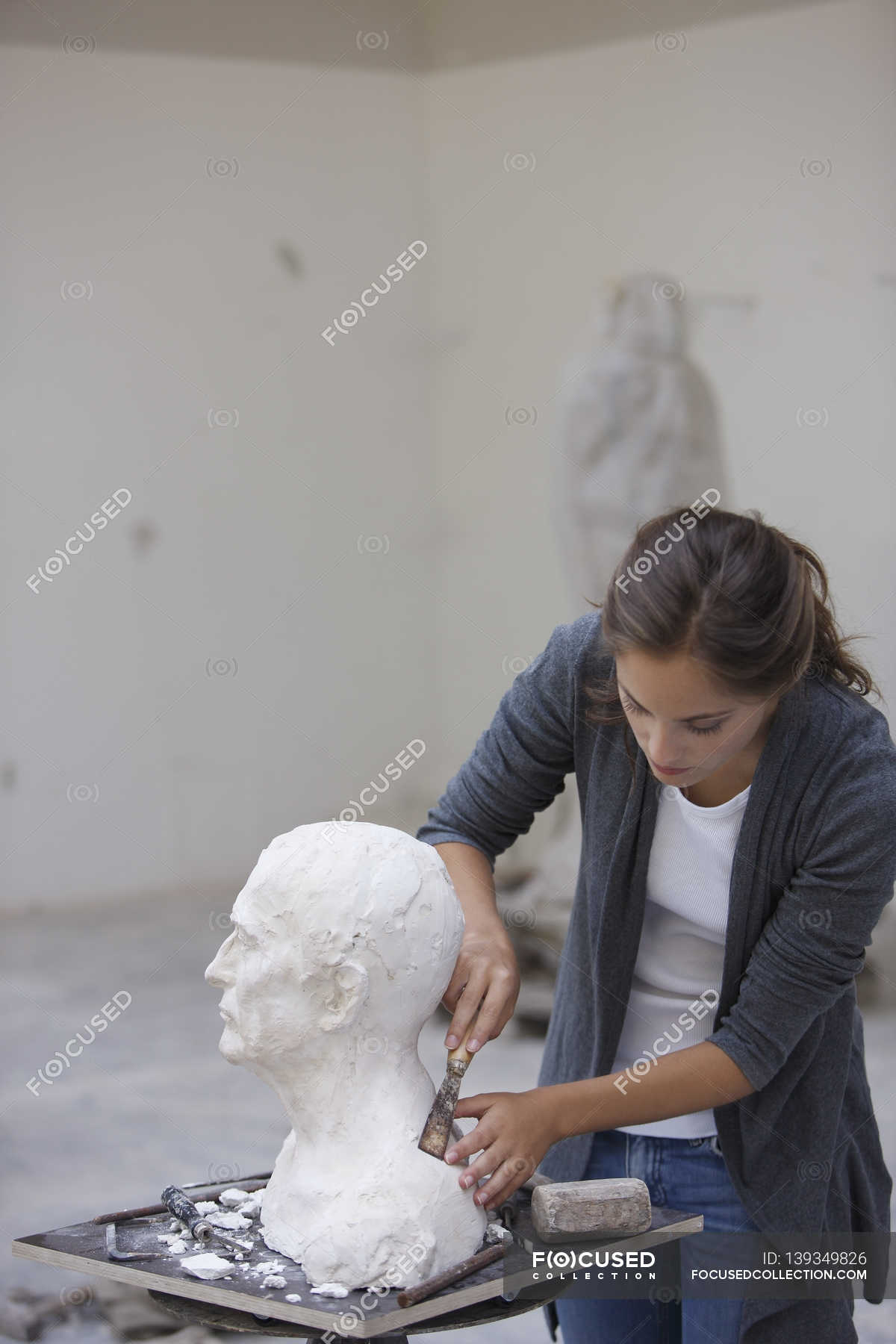 Woman working at sculpture — serene, one young woman Stock Photo