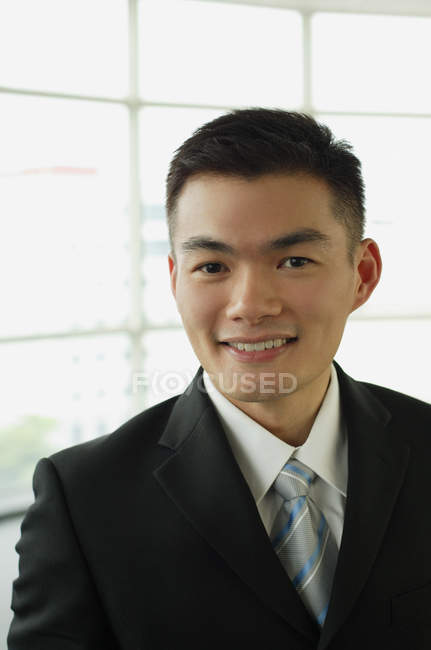 Businessman smiling at camera — Stock Photo
