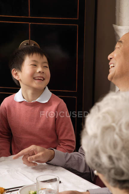 Grandfather and grandson laughing — Stock Photo