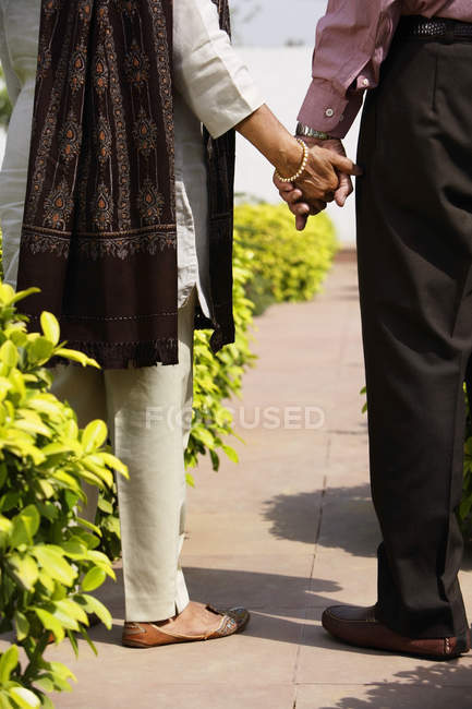 Senior couple with clasped hands — Stock Photo