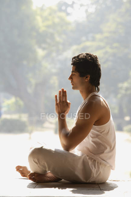 Man doing yoga exercises — Stock Photo