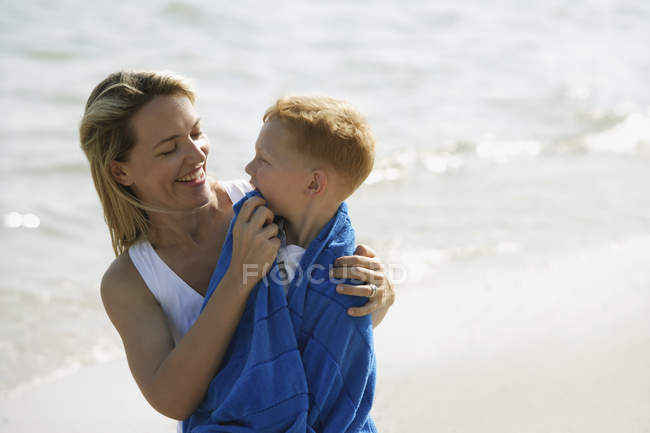 Mother and son at beach — Stock Photo