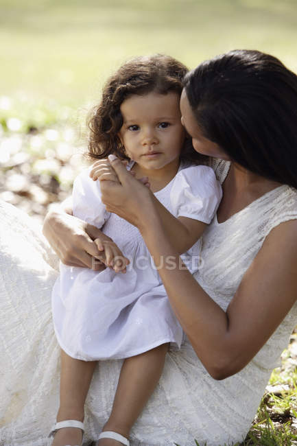Mother holding daughter — Stock Photo