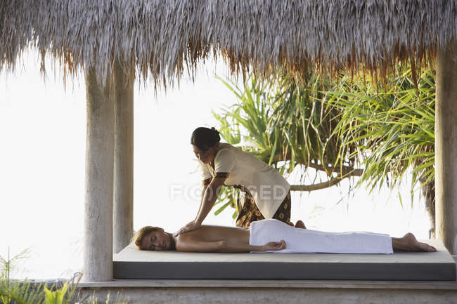 Woman receiving massage — Stock Photo