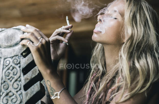 Portrait of smoking woman — Stock Photo