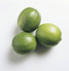 Three green Limes — Stock Photo