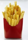 French fries potatoes in a red paper box — Stock Photo