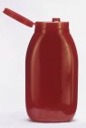 Ketchup en botella de plástico exprimido - foto de stock