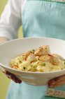 Ribbon pasta with scallops and capers — Stock Photo