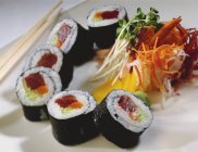 Sliced sushi tuna roll with veggies — Stock Photo