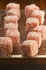 Closeup view of Lamingtons on wire rack — Stock Photo