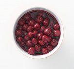 Bowl of cherry compote — Stock Photo